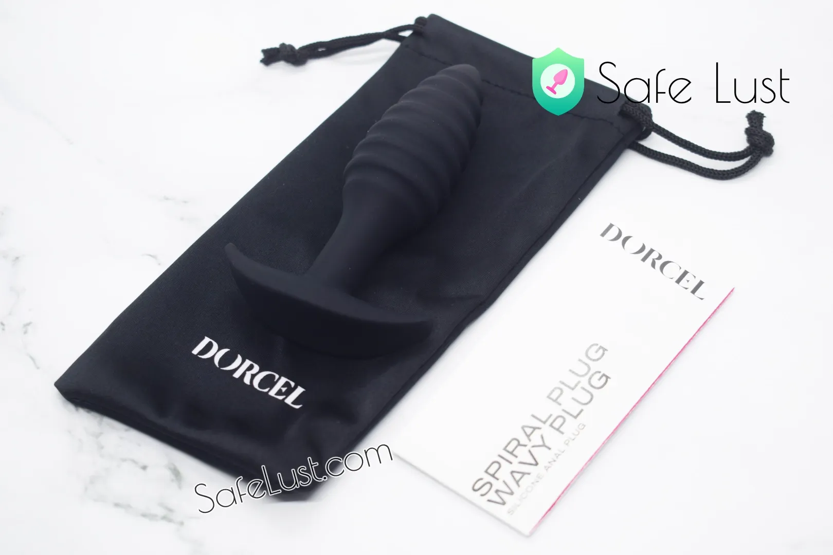 The Dorcel Spiral plug and its included storage pouch and user manual
