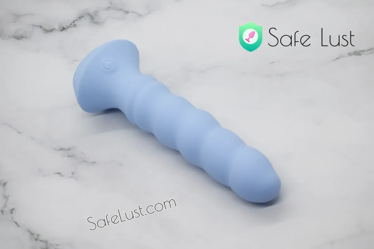 The Sinful Dancing Beads dildo lying on its side